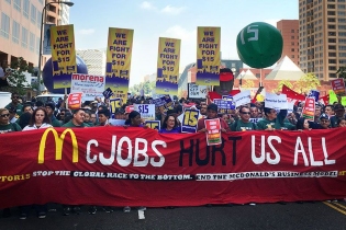 fight for fifteen rally. "McJobs hurt us all" banner in front